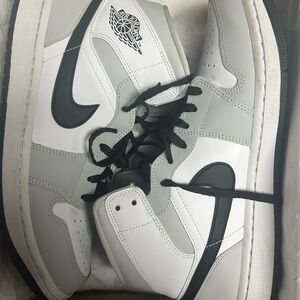 Nike Gray and White Sneakers with Iconic Design